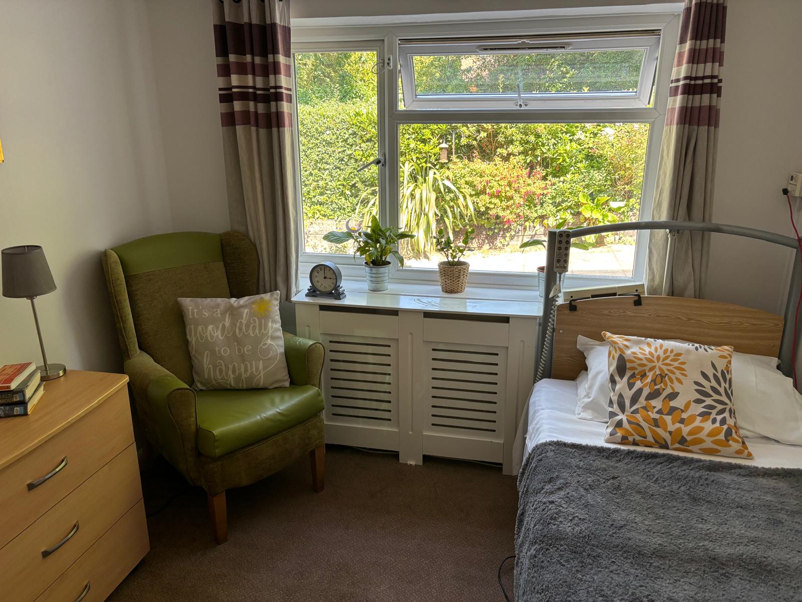 Bedroom with bed, furniture and a view of the garden