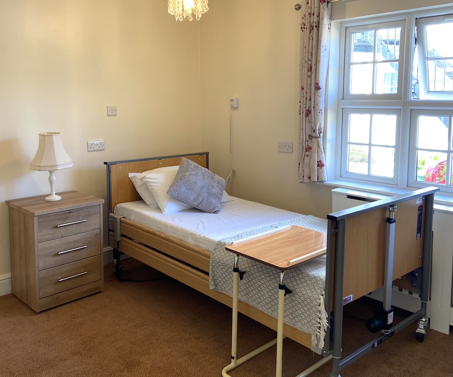A well presented room with an adapted bed