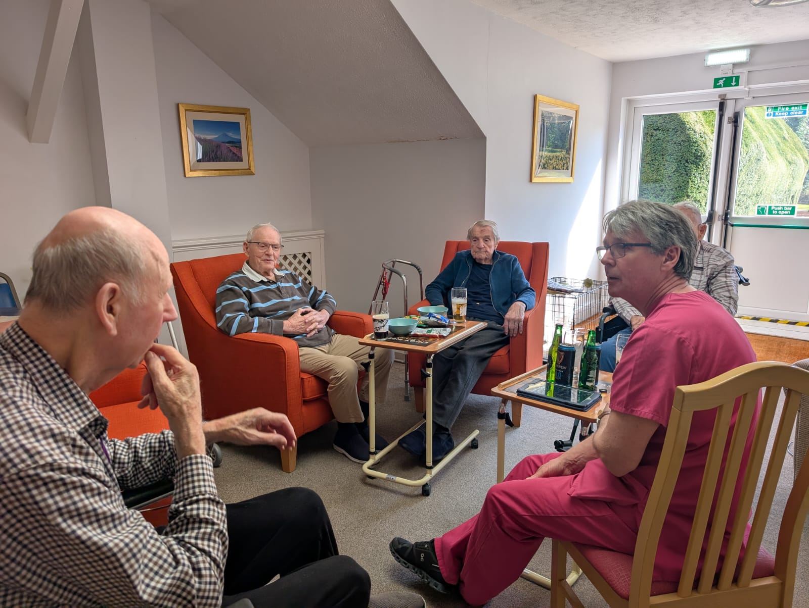 A group of men sat around chatting