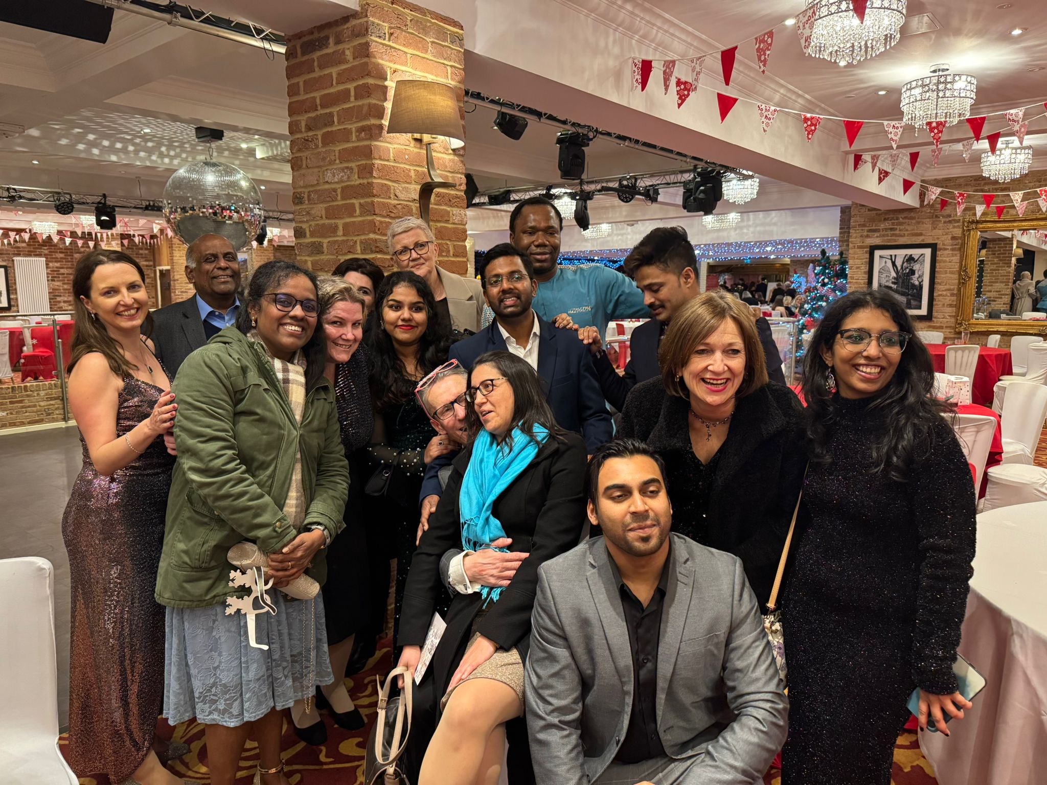 A group of people smiling at a party 