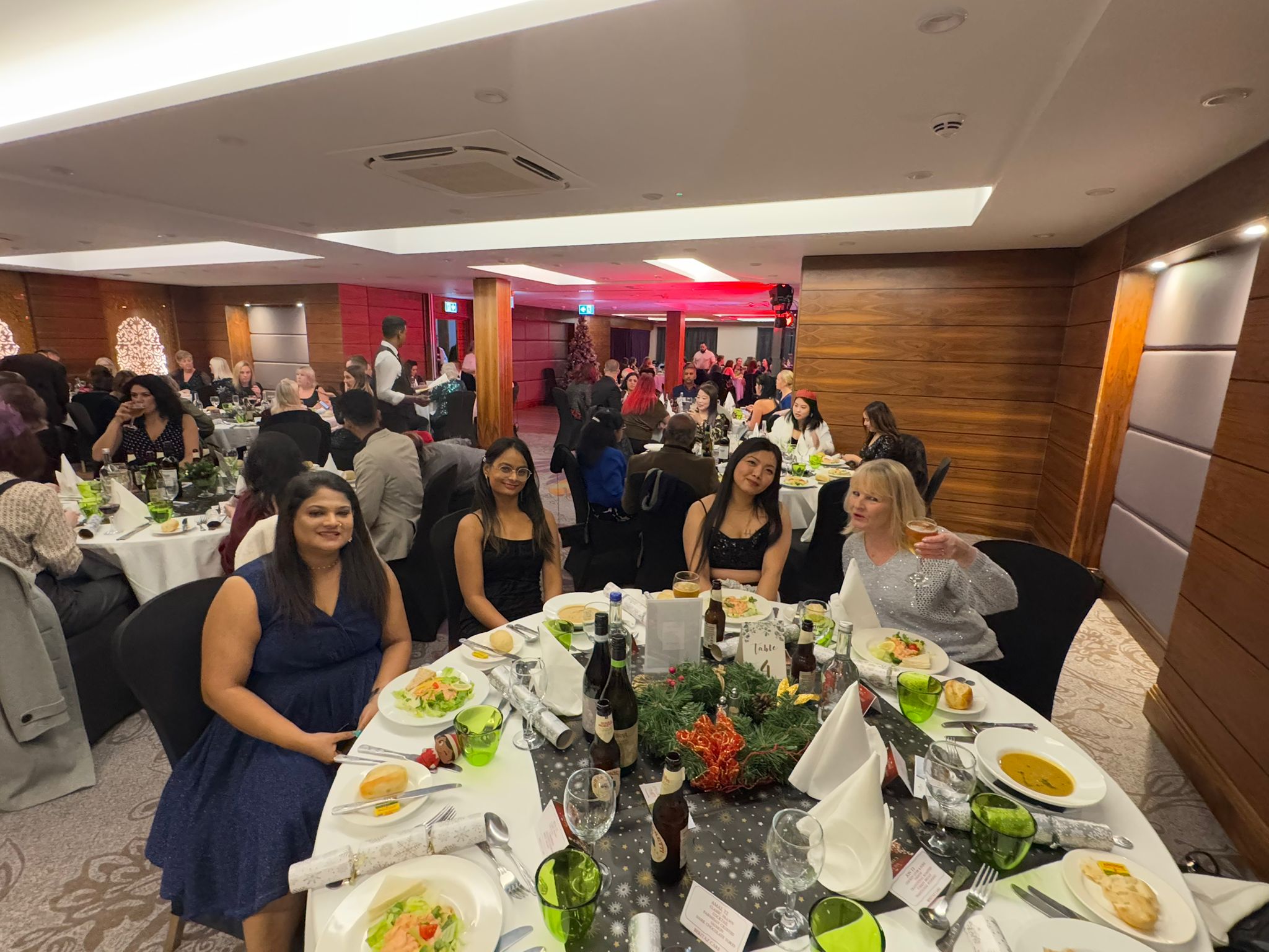 A group of people sat at a table at a party
