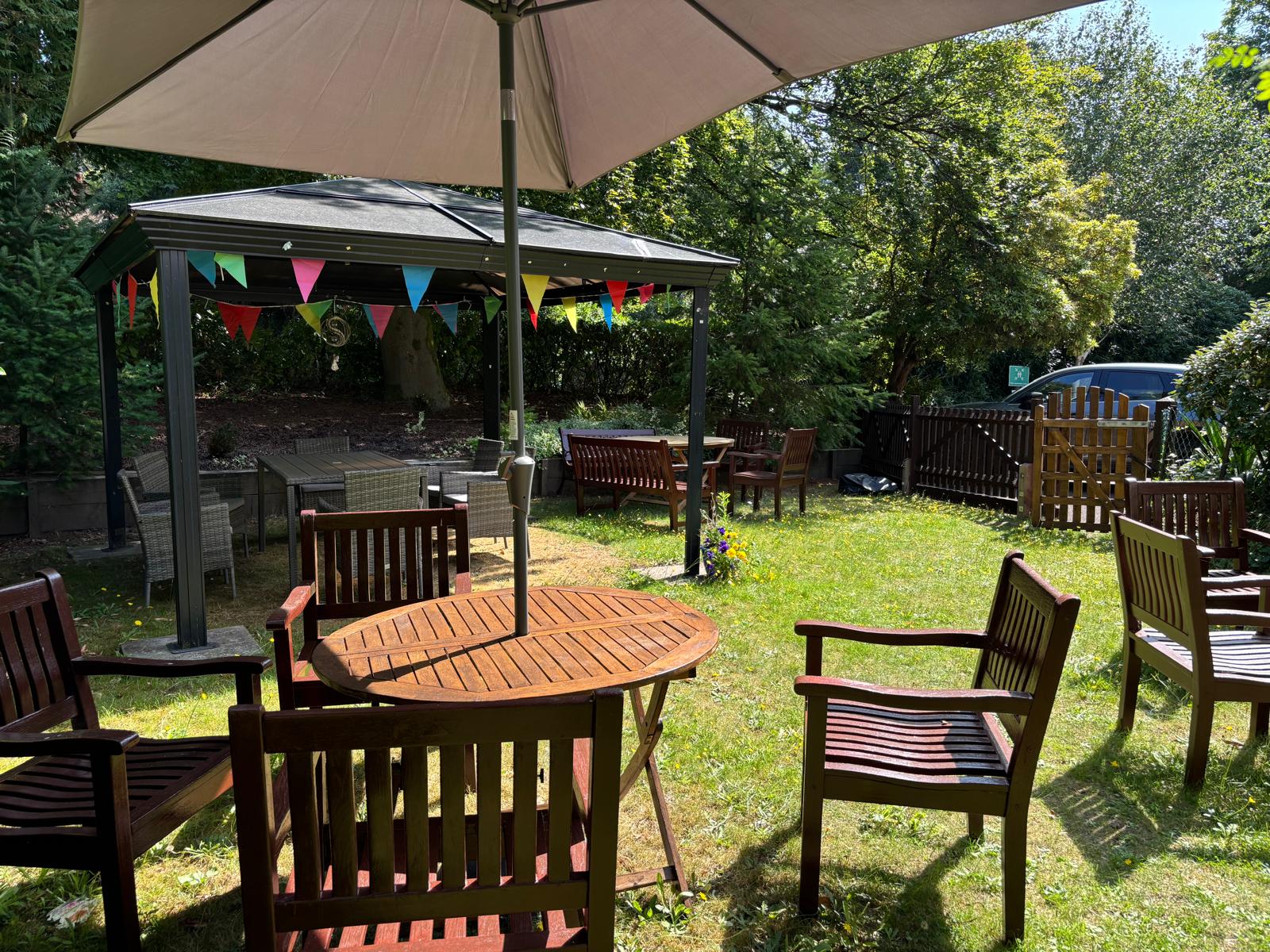 A sunny garden with garden furniture