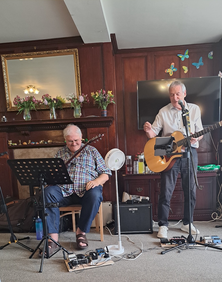 A band singing and playing guitars