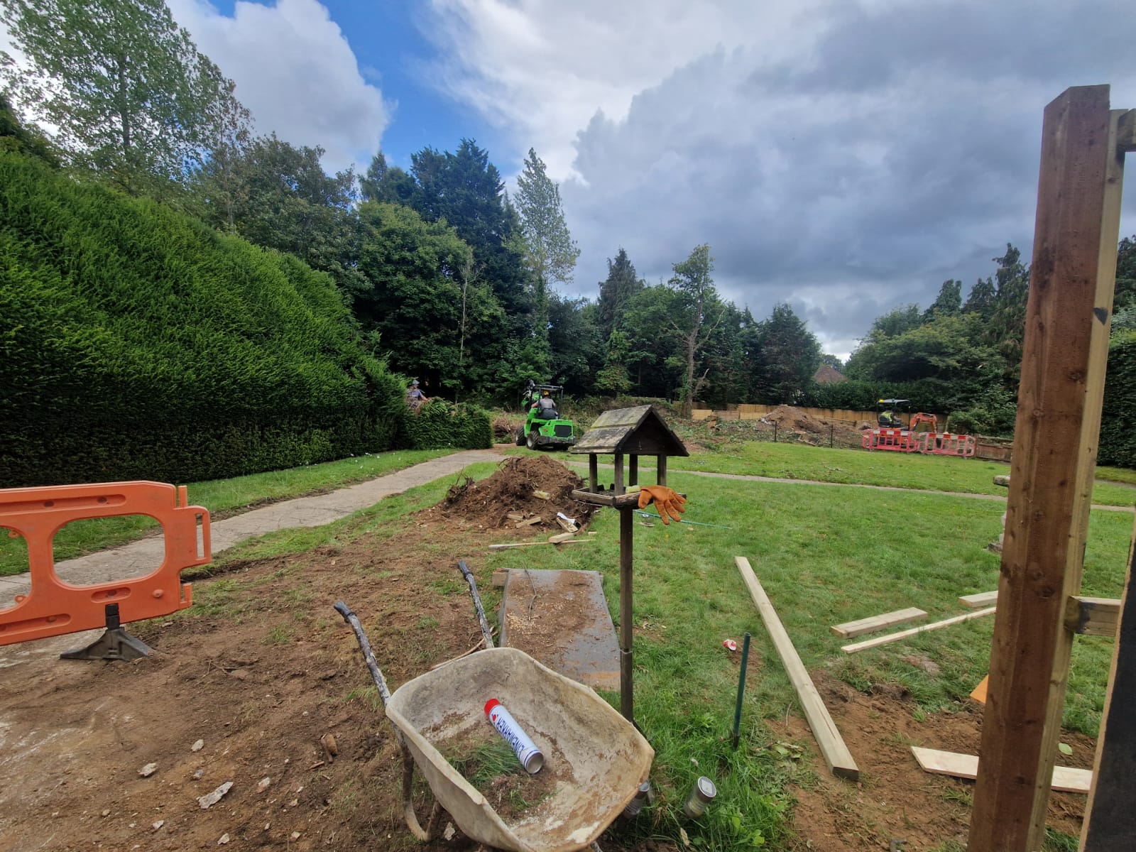 Construction work taking place and ground being dug with tools around