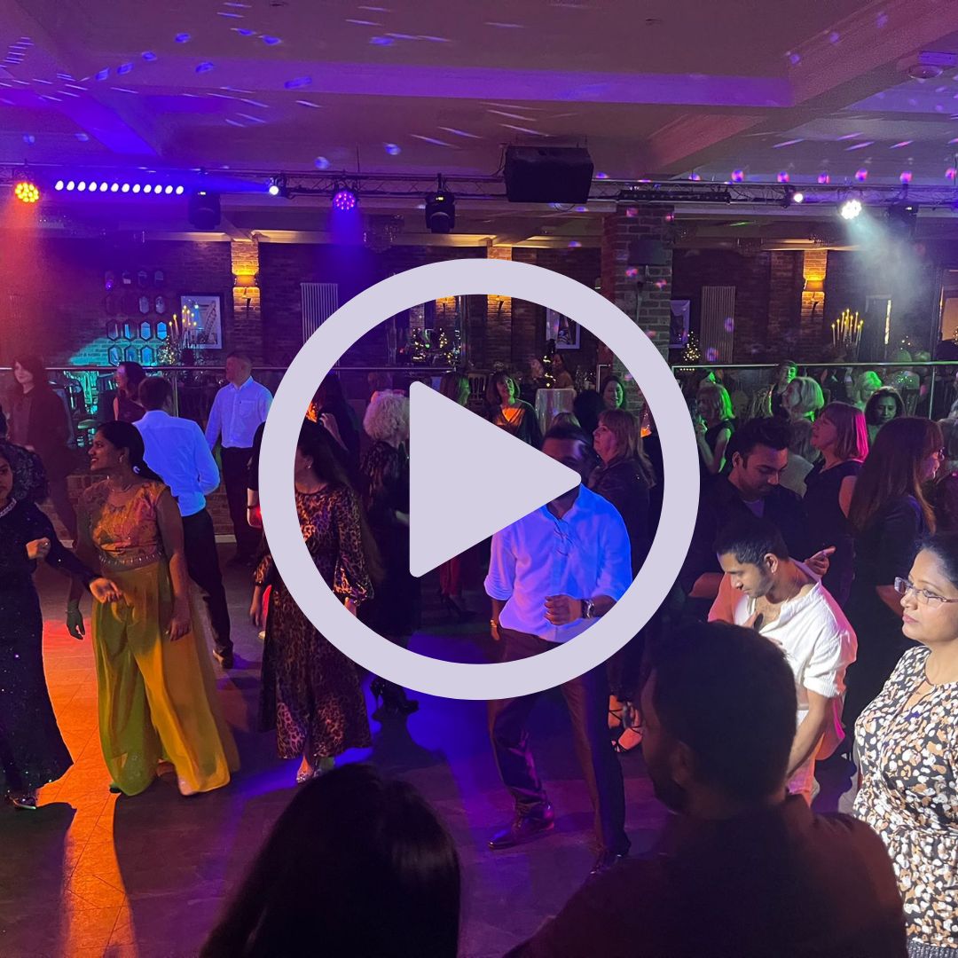 A group of people on the dancefloor at a party