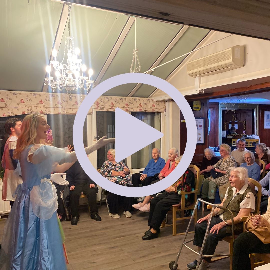 A group of people watching a pantomime