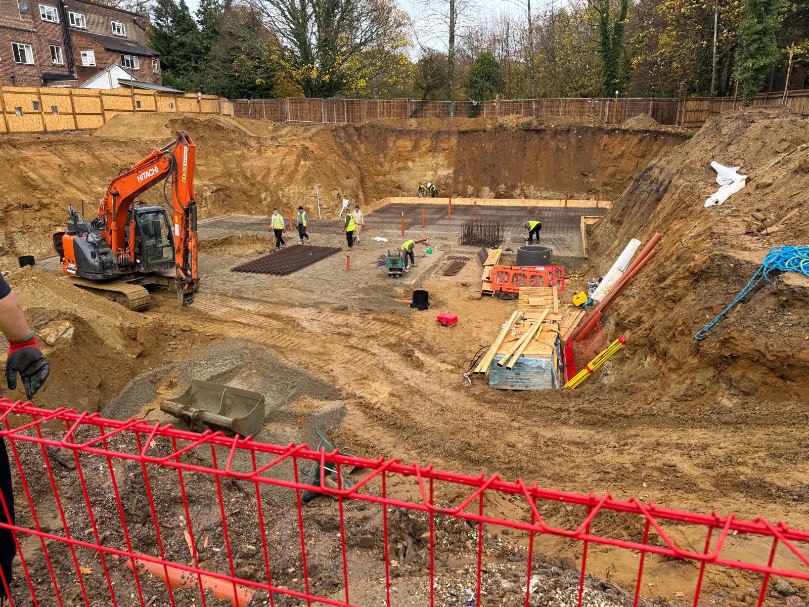 a construction site with workers and machinery