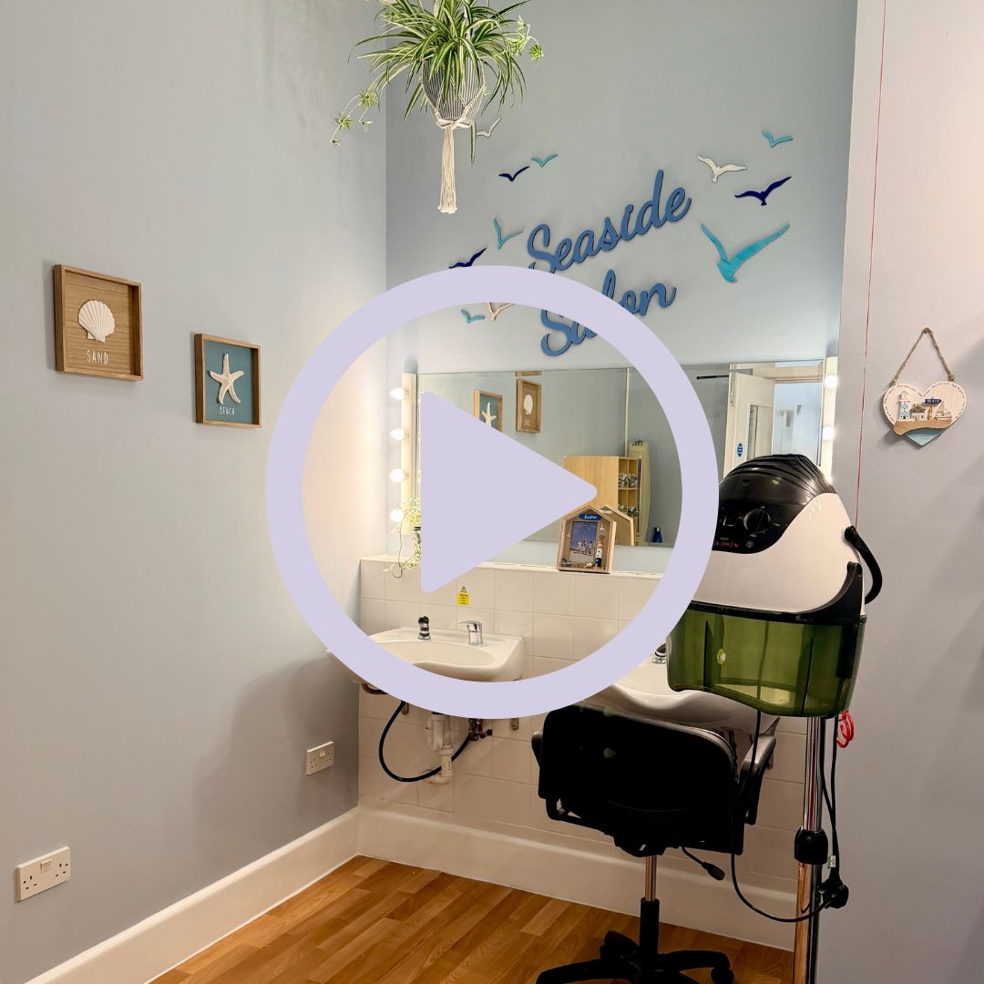 A blue salon with seaside themed decor