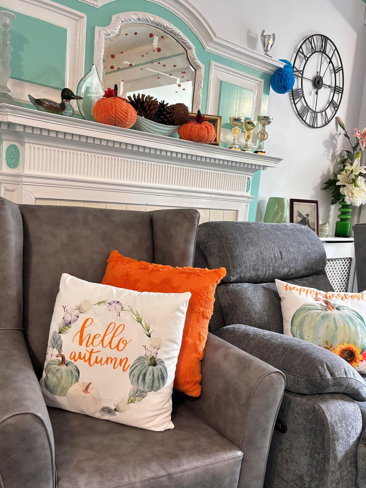 A comfortable lounge with armchairs and autumnal decor