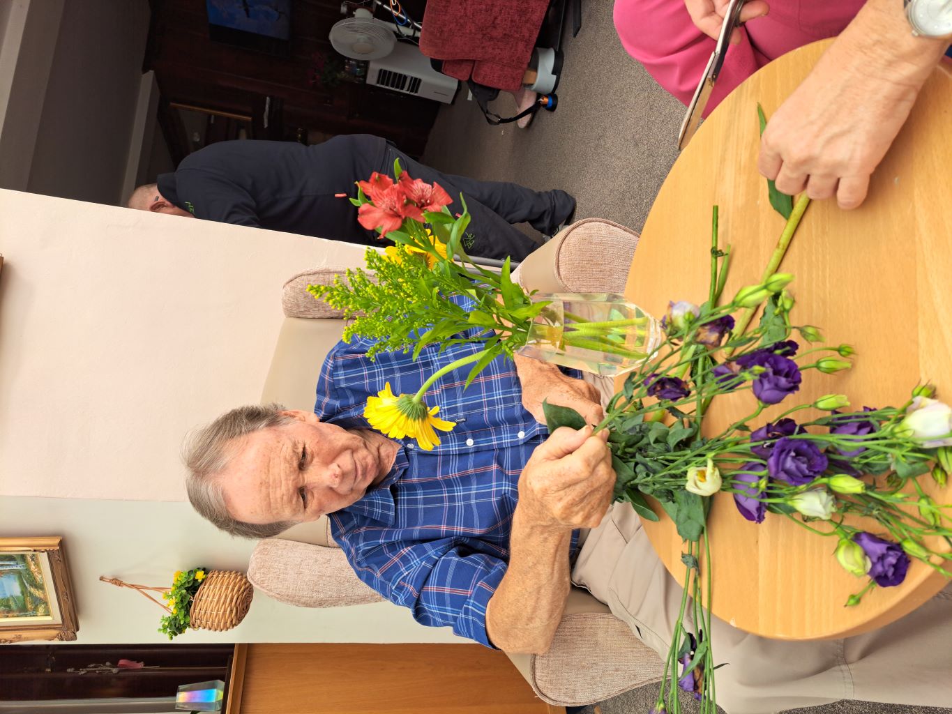 Man arranging flowers