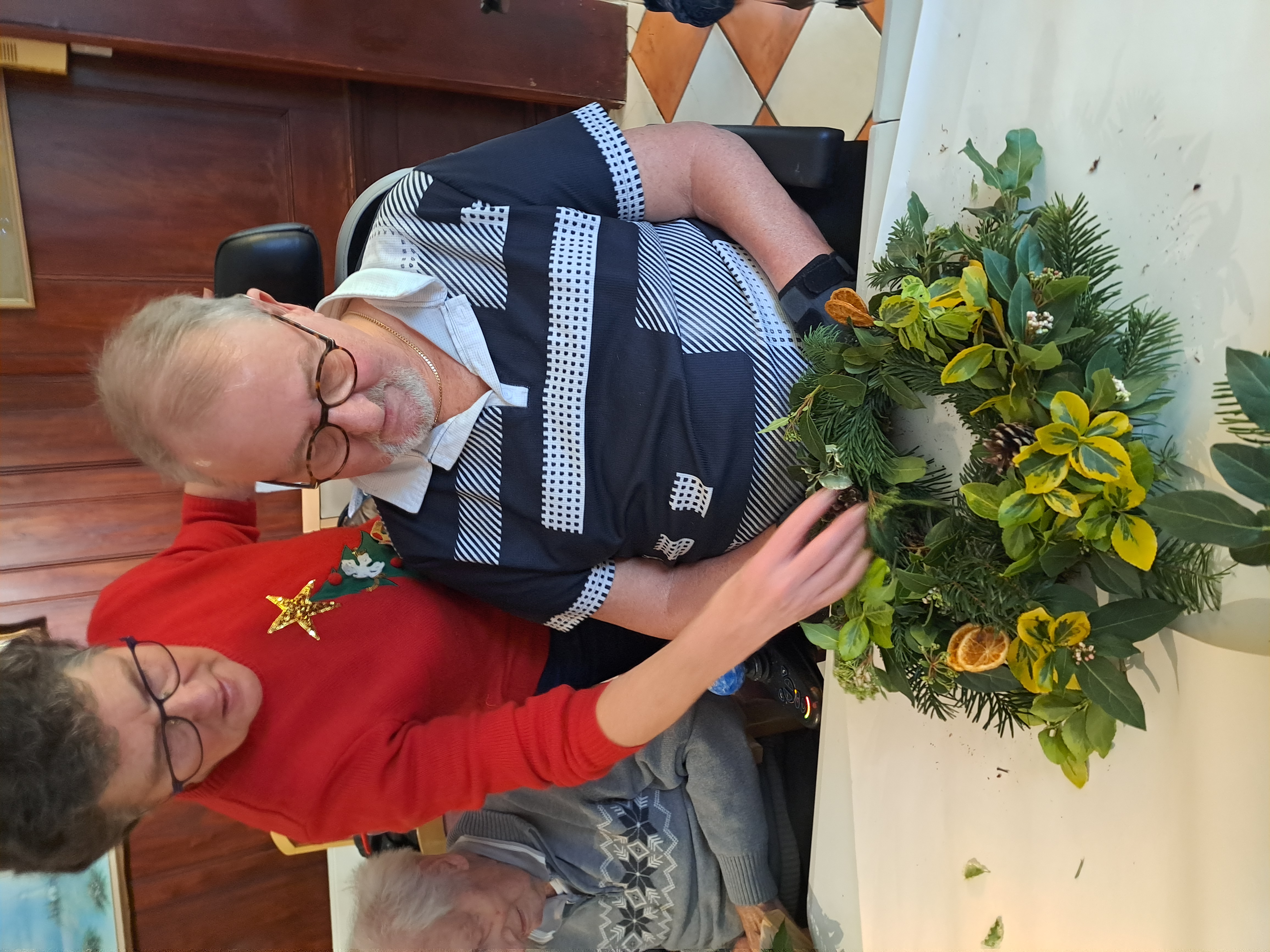 A man making a christmas decoration
