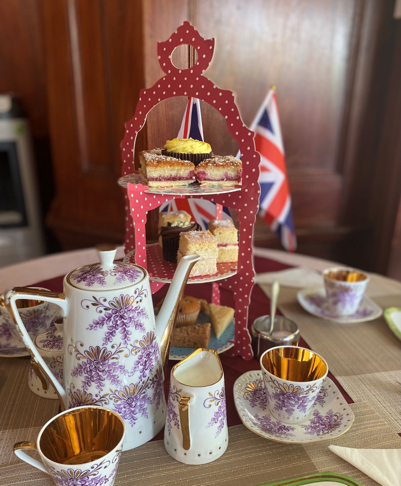 A spread for afternoon tea with cakes on a stand