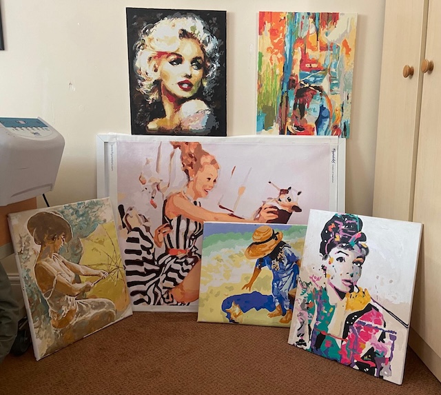 Display of brightly coloured paintings