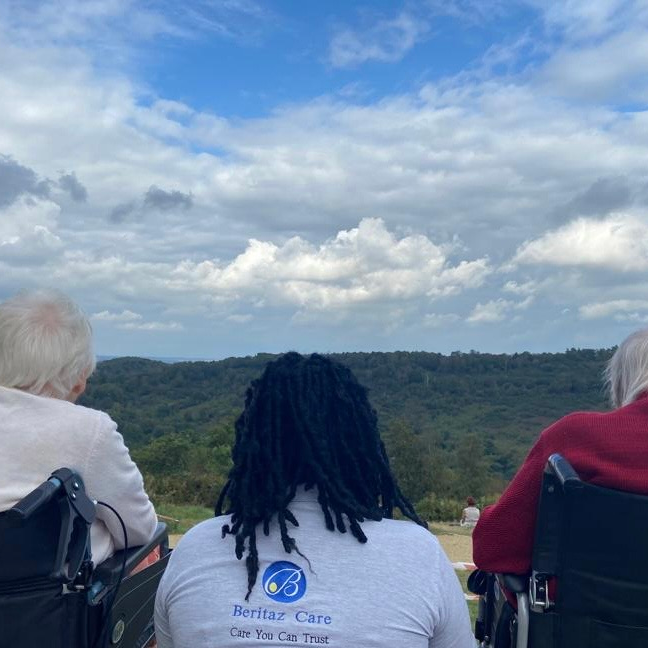 Residents with a staff member enjoyng the rural view during a minibus trip