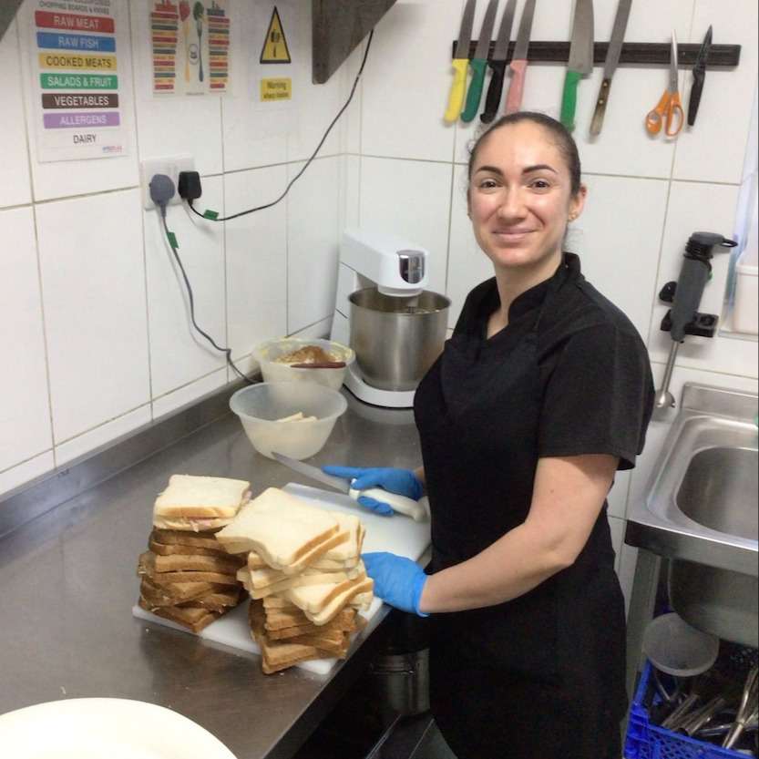 Staff member making lunch in the kitchen