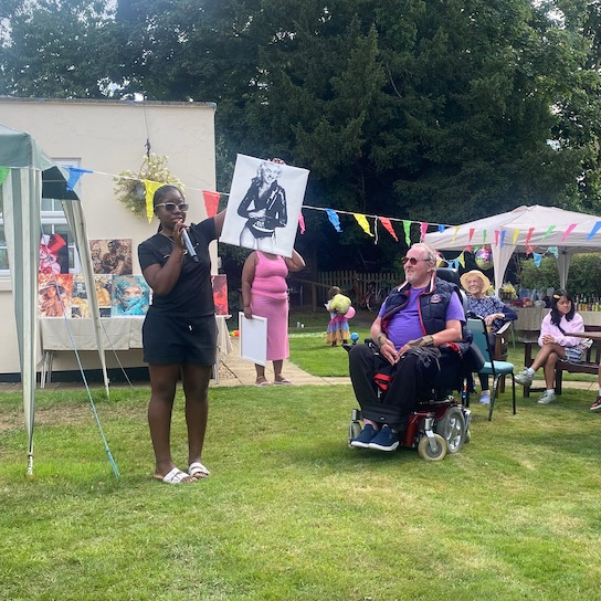 Hosting an art auction at the Ashton Manor summer party