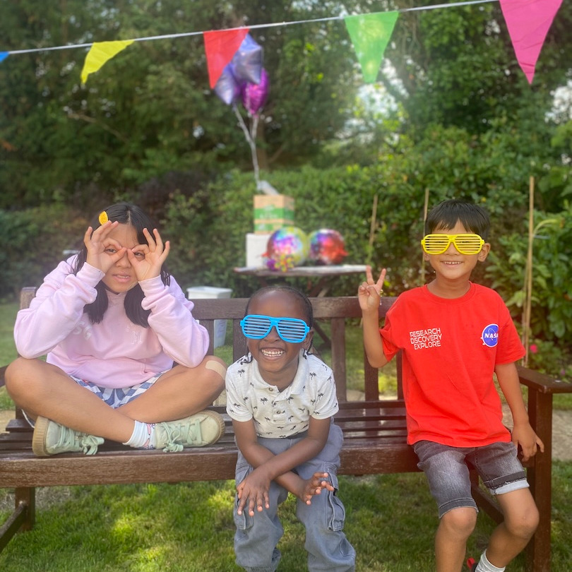 Children having fun and being silly at a summer garden party