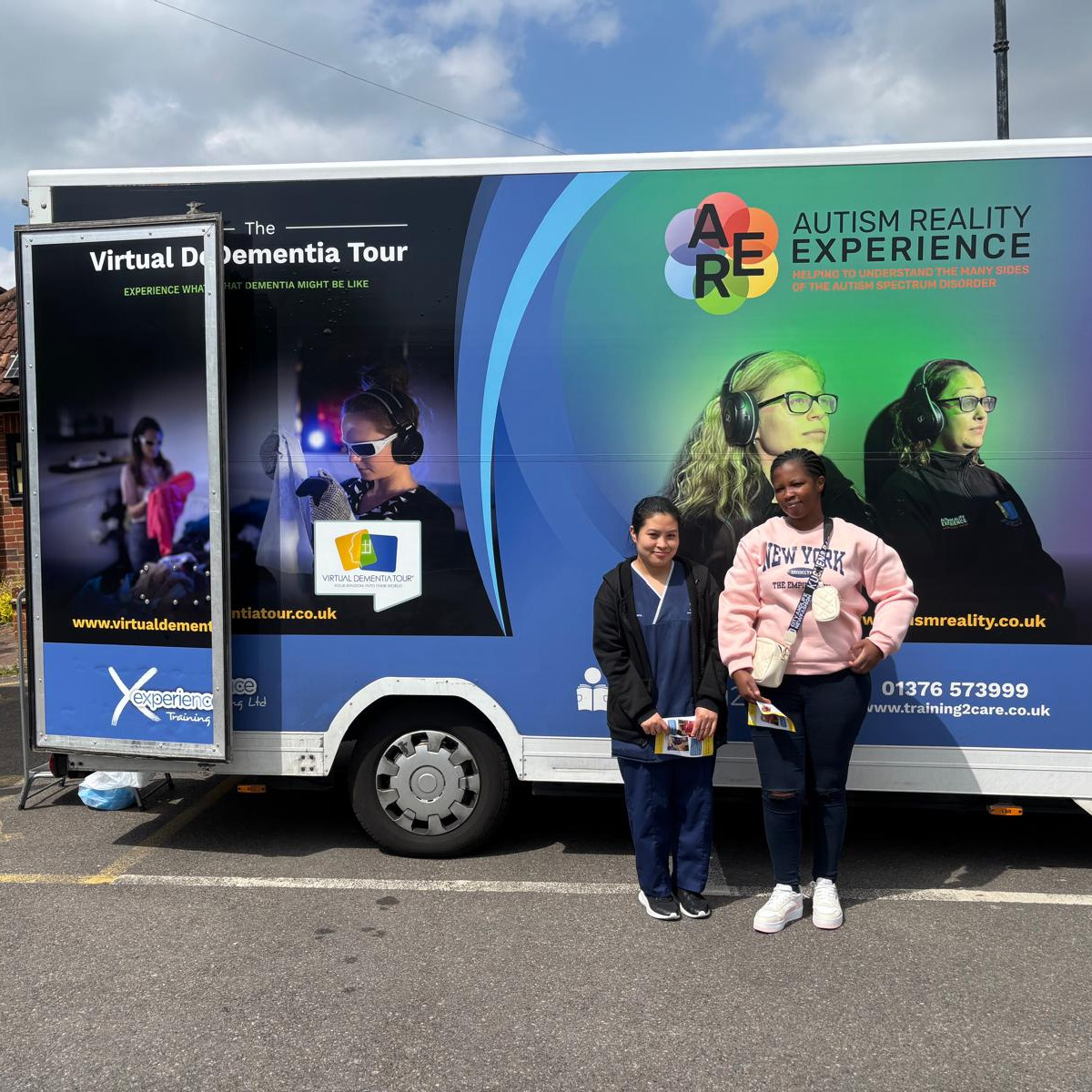 Team members taking part in dementia bus training experience