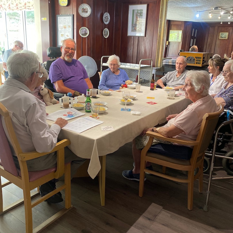  A group of residents sat around a table taking part in a quiz
