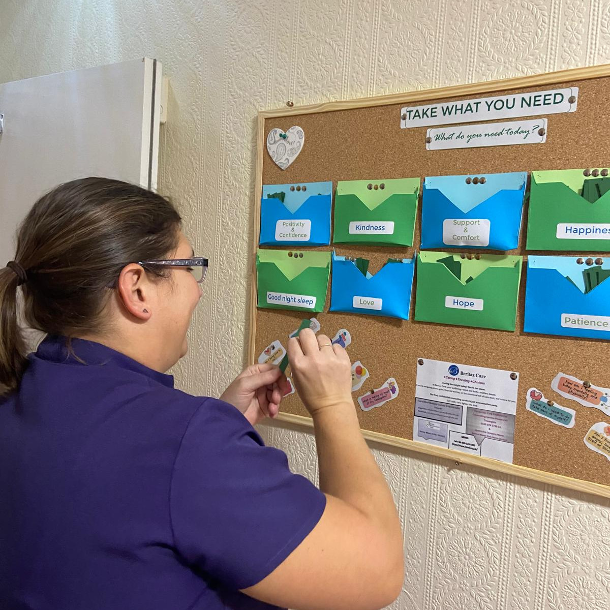 Staff member looking at a notice board