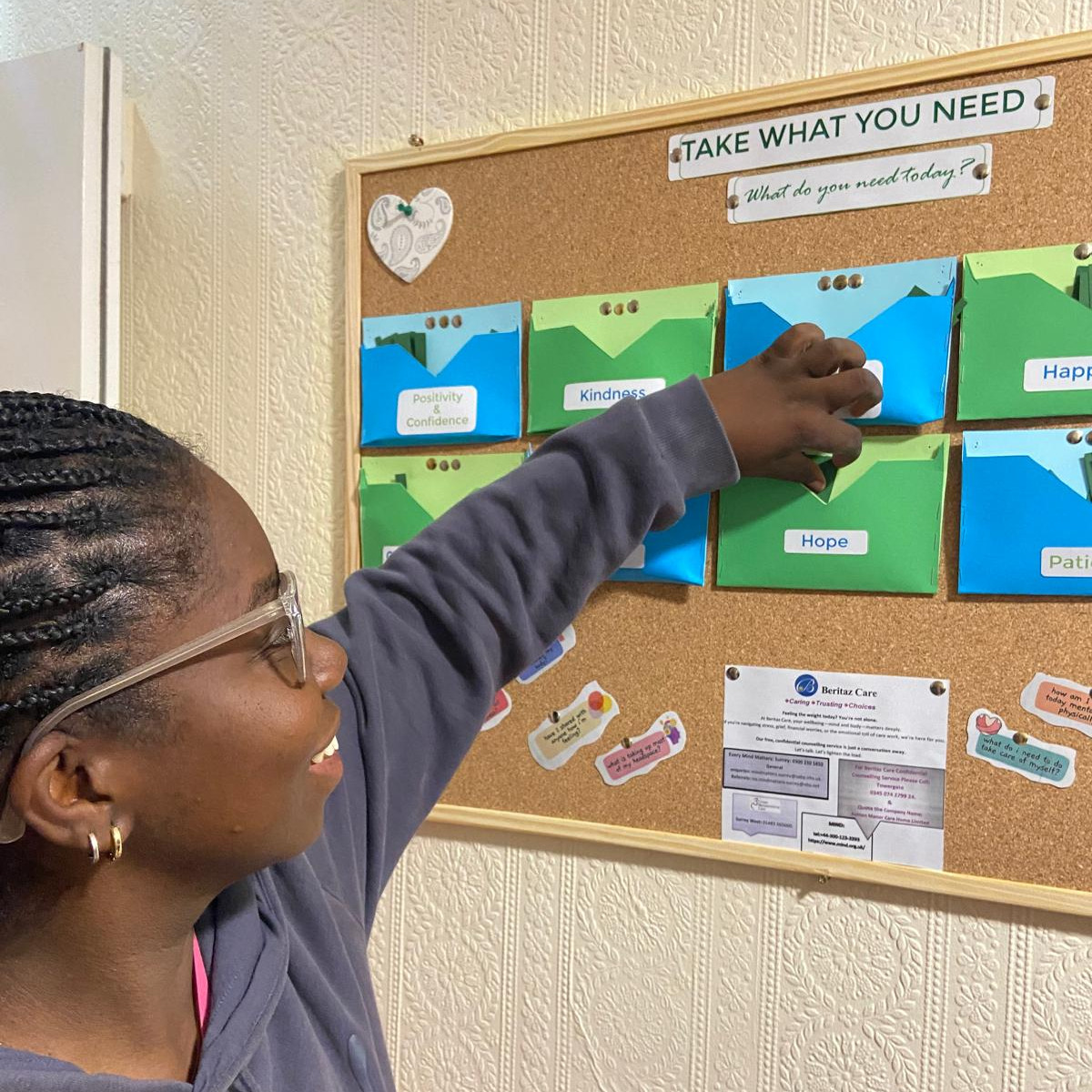 Staff member looking at a notice board