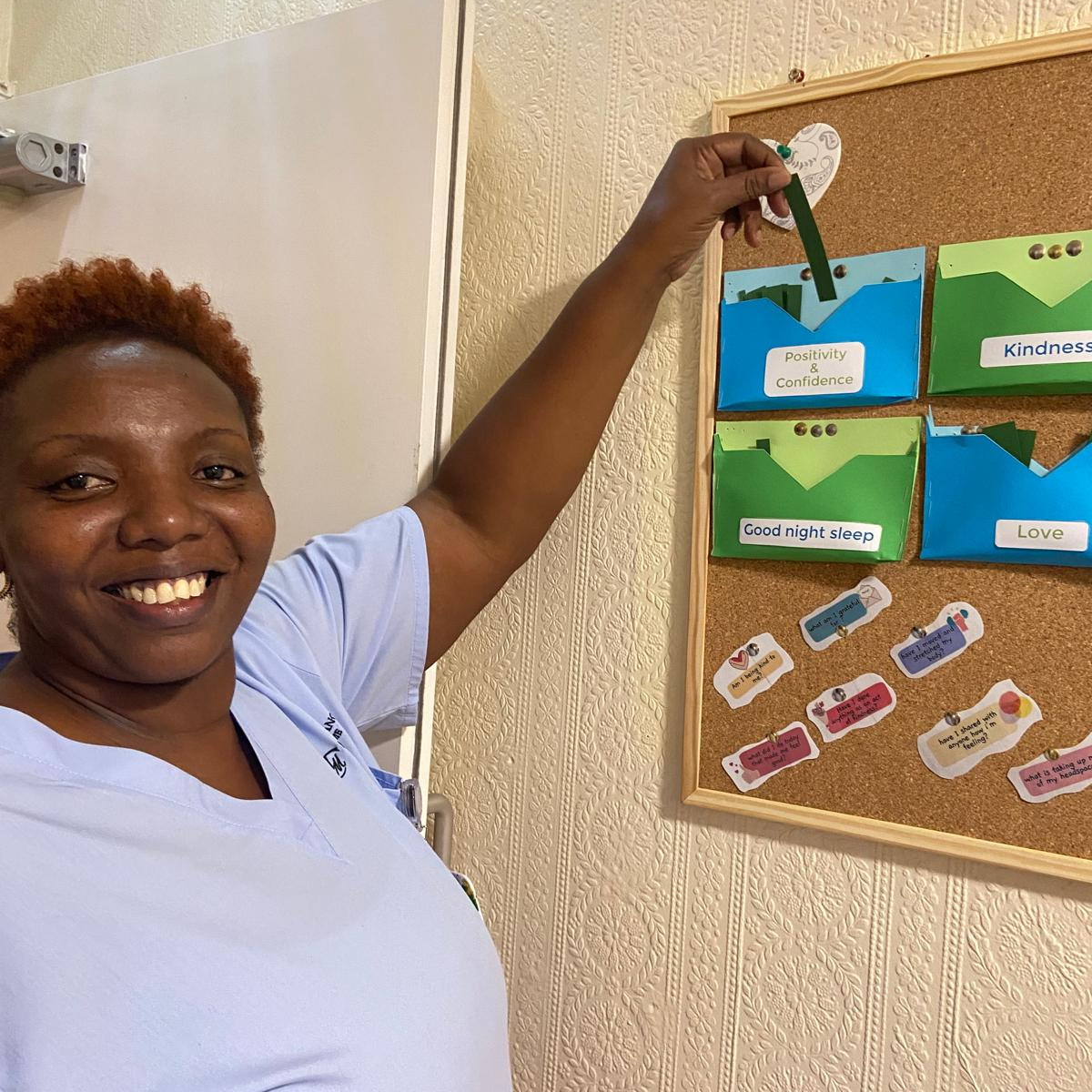 Staff member looking at a notice board