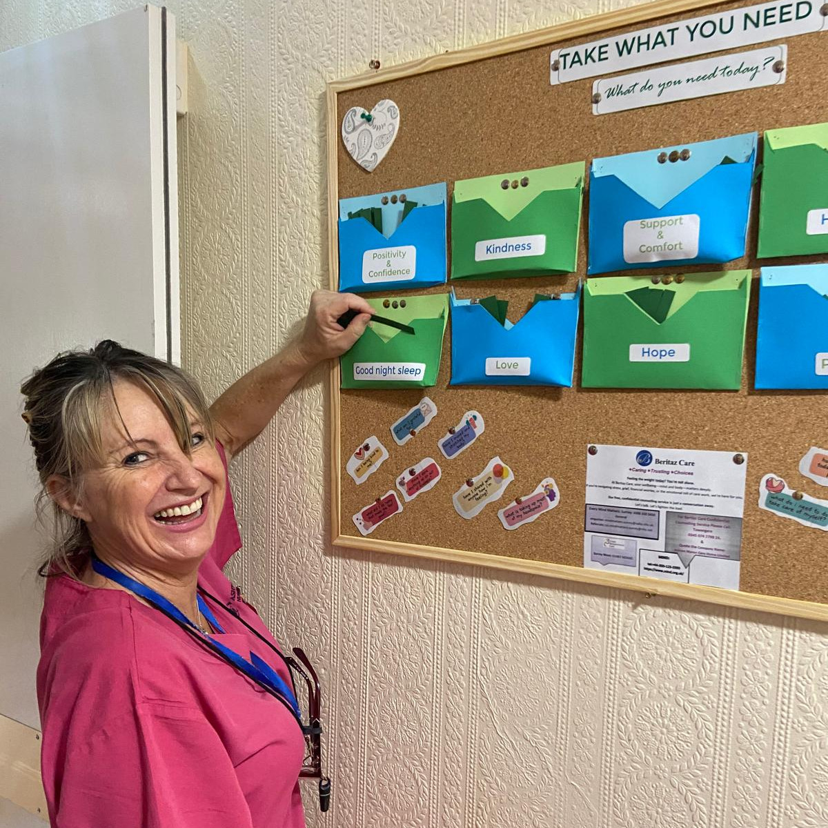 Staff member looking at a notice board