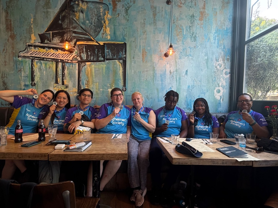 A group of people sat at a table in a restaurant