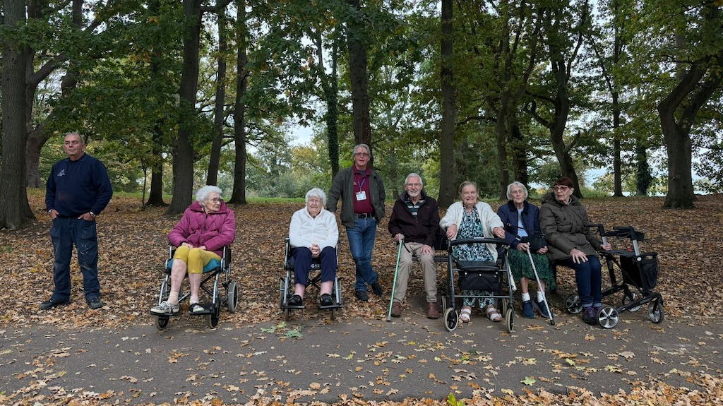 A group of people out on a walk in the woods