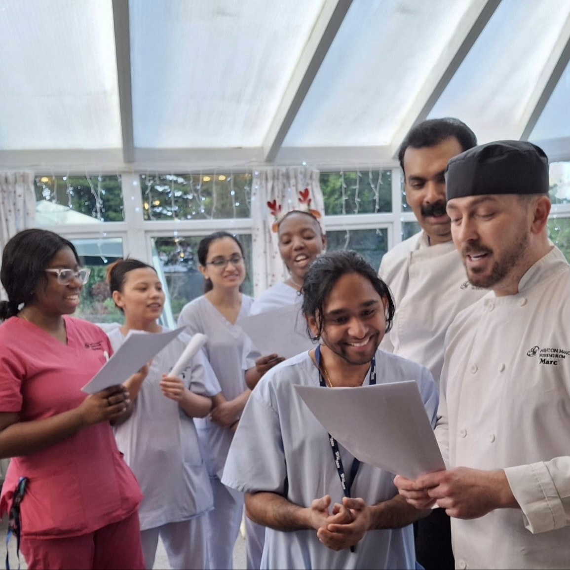 A photo of the Ashton Manor team singing