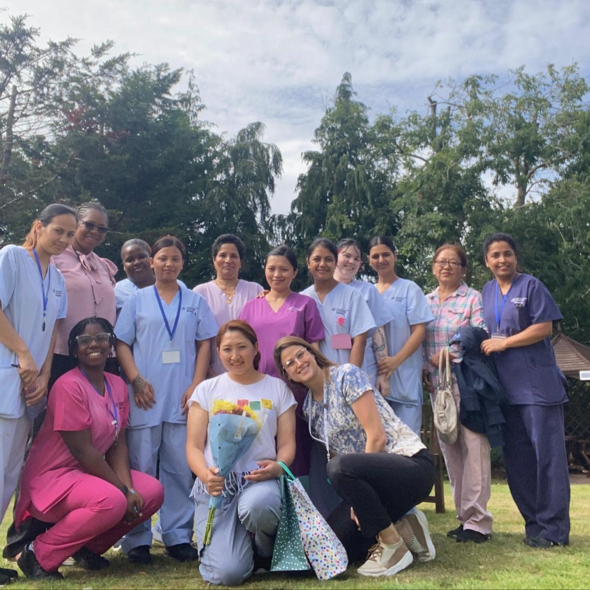 A group of people wearing medical uniforms outside
