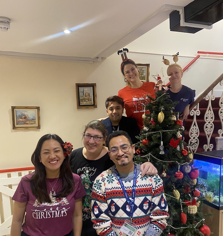 A photo of the Ashton Manor team wearing Christmas jumpers