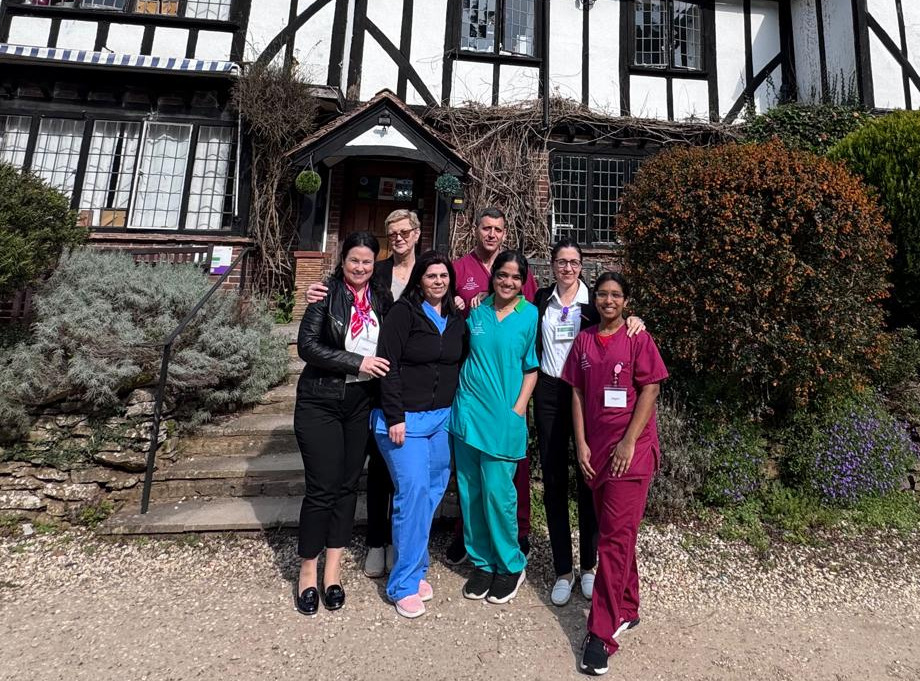 Robertson team photo outside the home