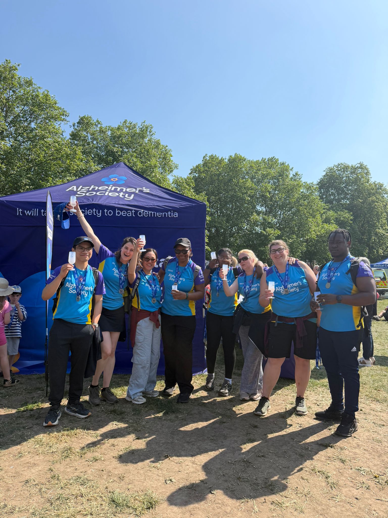 A photo of the Ashton Manor team after a sponsored walk